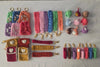Handmade crochet keychains, wristlets, and pouches in colorful yarn on a light background.