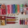 Colorful handmade crochet keychains, wristlets, and small amigurumi plush charms on display