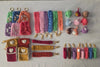 Colorful handmade crochet keychains, wristlets, and small amigurumi plush charms on display