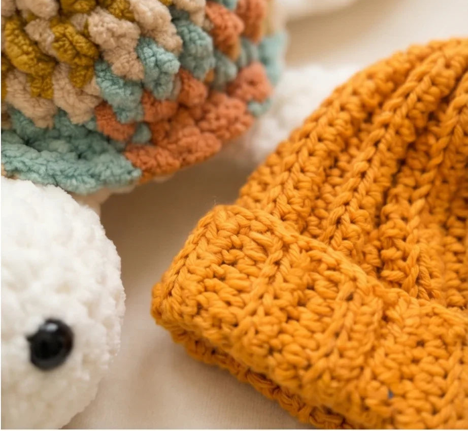 Cozy handmade crochet hats in warm tones, perfect for comfort and creativity.