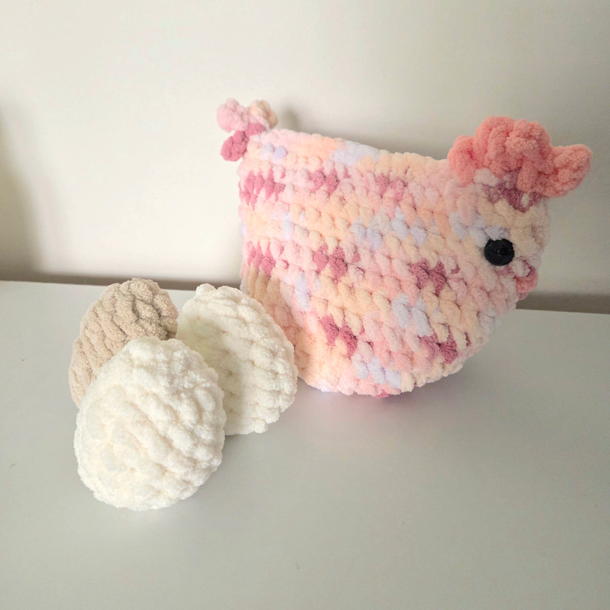 Handmade crochet chicken with eggs, cozy pastel design for home decor or gifts
