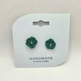 Handmade crochet flower earrings in green and blue, displayed on white card with 'Handmade by Erika Liesel' text.