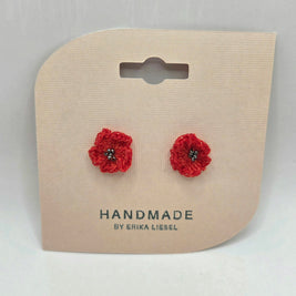 Handmade red crochet flower earrings with bead centers on display card