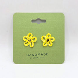 Handmade yellow crochet flower earrings on green card, cozy and creative gift