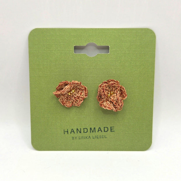 Handmade crochet flower earrings with gold beads on green card