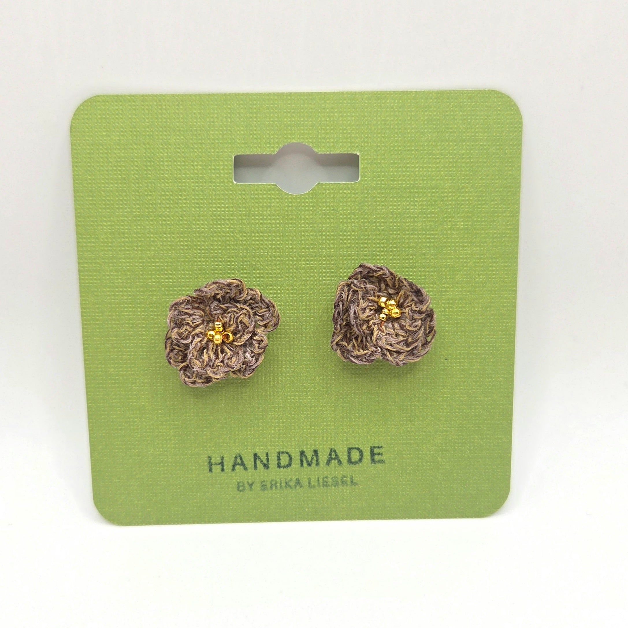 Handmade crochet flower earrings with gold beads on green card