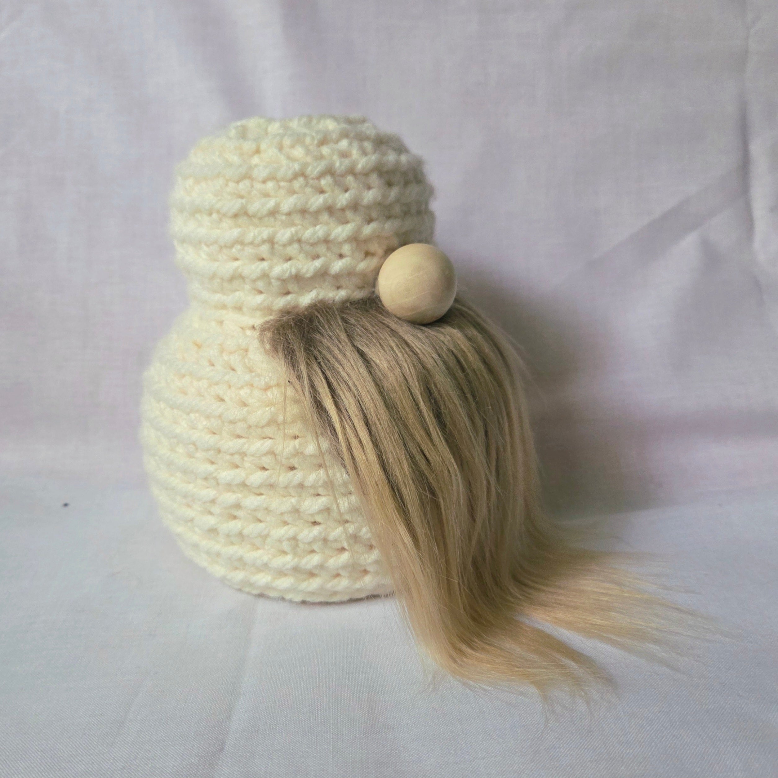 Handmade crochet gnome with blonde hair and wooden bead, cozy and creative decor