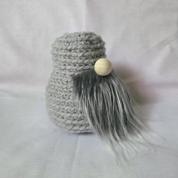 Handmade gray crochet gnome with wooden bead face and long gray beard, cozy home decor