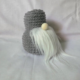 Handmade gray crochet gnome with white beard and wooden nose