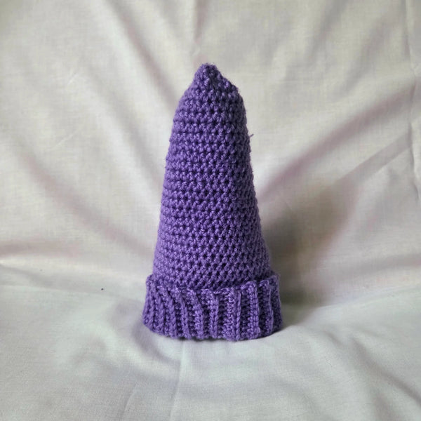Handmade purple crochet gnome hat with ribbed brim, cozy and whimsical winter accessory