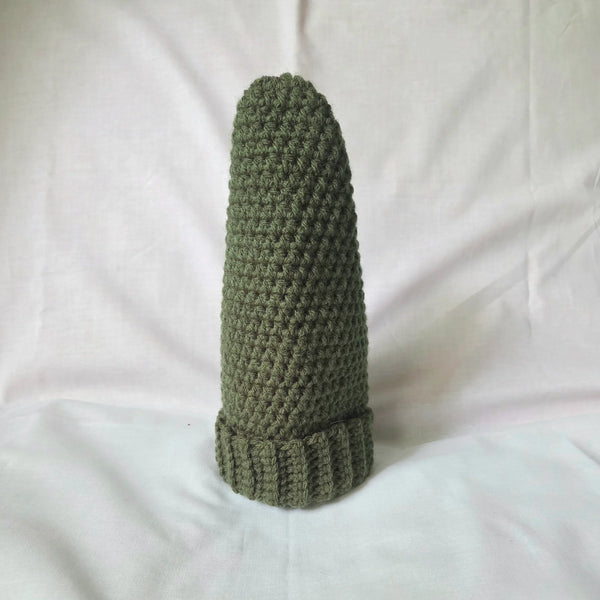Handmade olive green crochet beanie with ribbed brim, cozy winter hat on white background