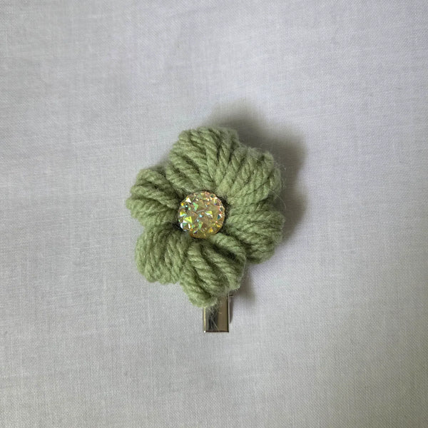 Handmade green crochet flower hair clip with sparkling center