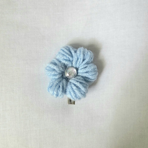 Light blue crocheted flower hair clip with shiny center