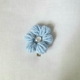 Light blue crocheted flower hair clip with shiny center