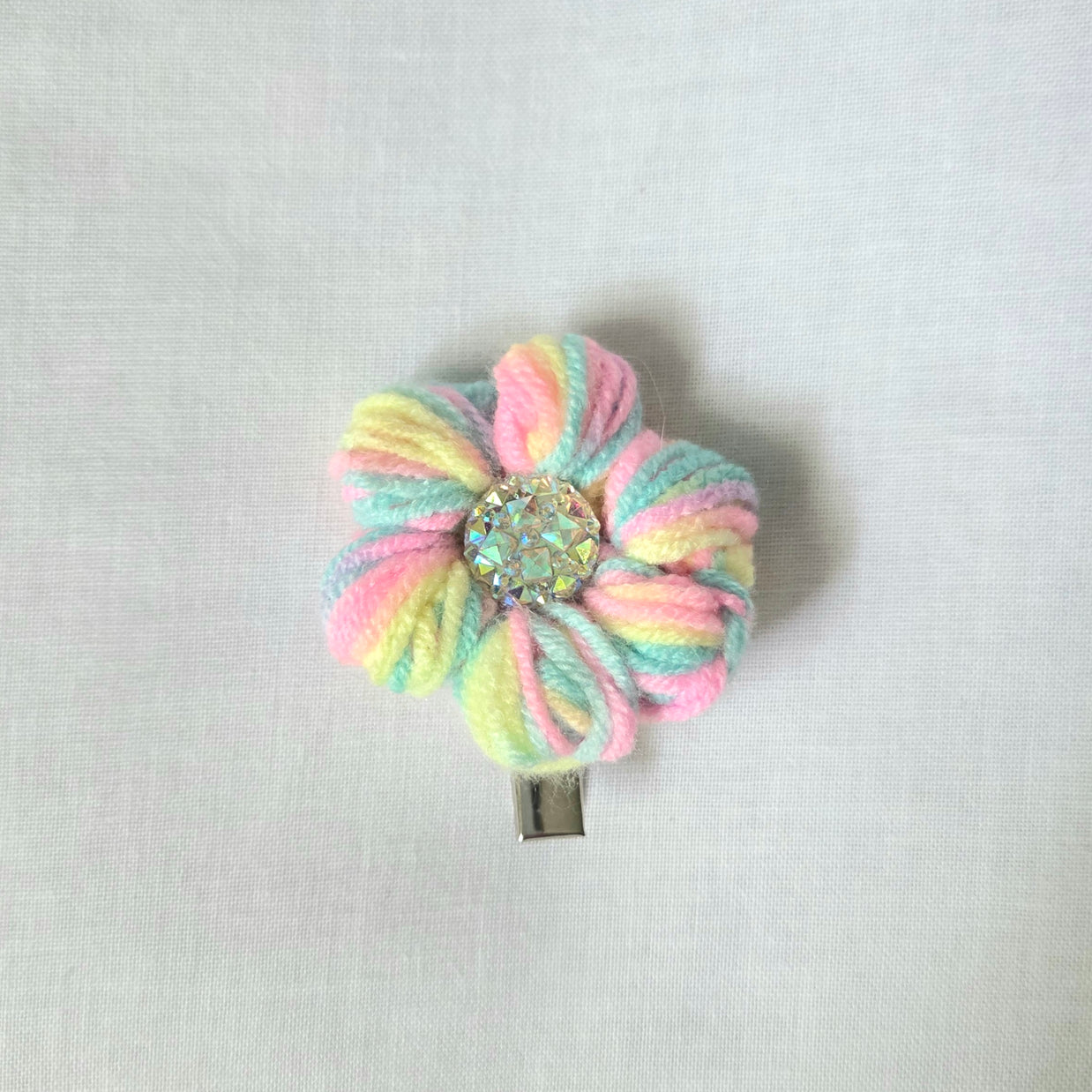Pastel rainbow crochet flower hair clip with sparkling center