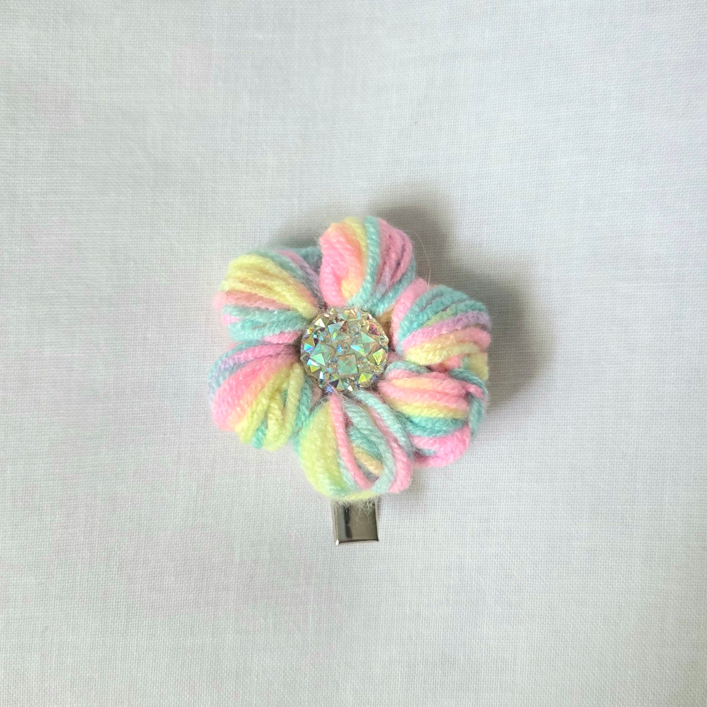 Pastel rainbow crochet flower hair clip with sparkling center