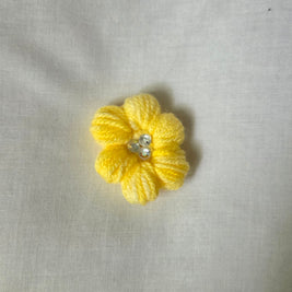 Handmade yellow crochet flower with pearl center, cozy craft gift