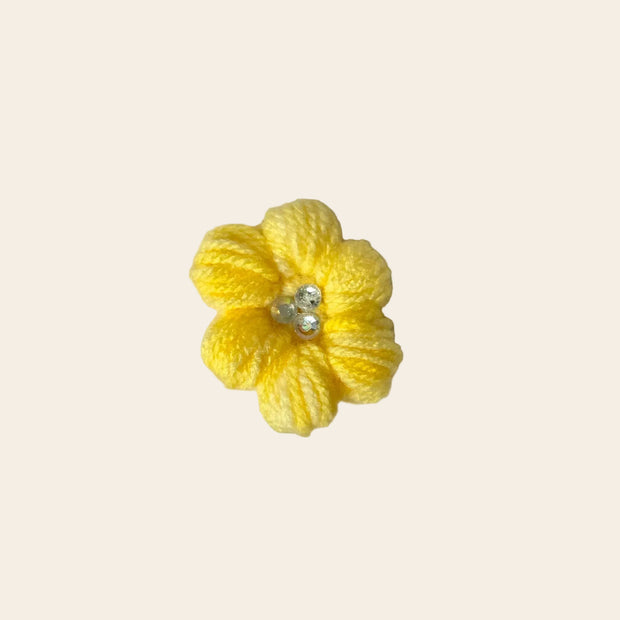 Handmade yellow crochet flower with pearl center, cozy craft gift