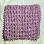Handmade lavender crochet dishcloth with scalloped edge, cozy kitchen textile