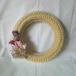Handmade crochet wreath with dried flowers, cozy home decor