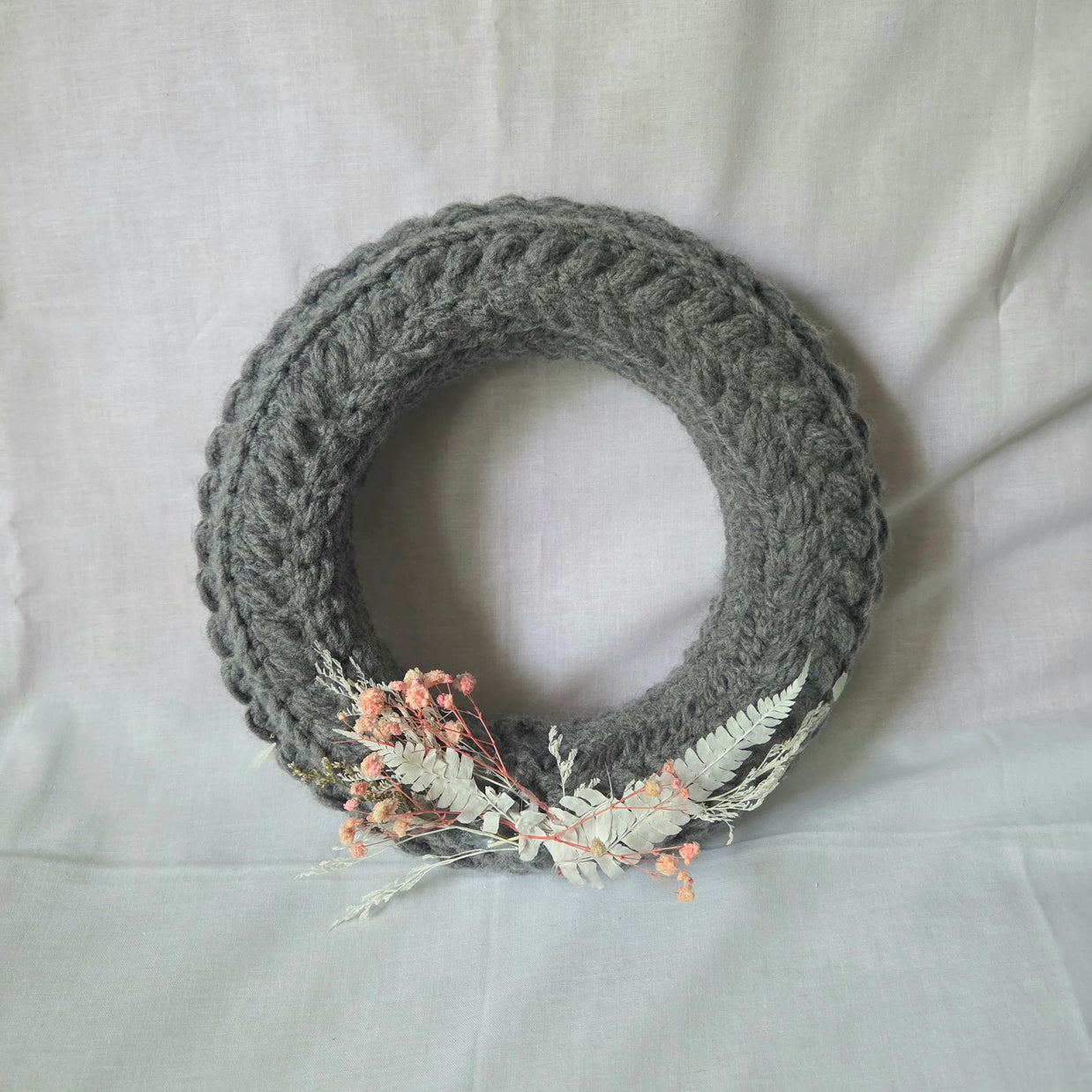 Gray crochet wreath with dried flowers and ferns, cozy handmade decor