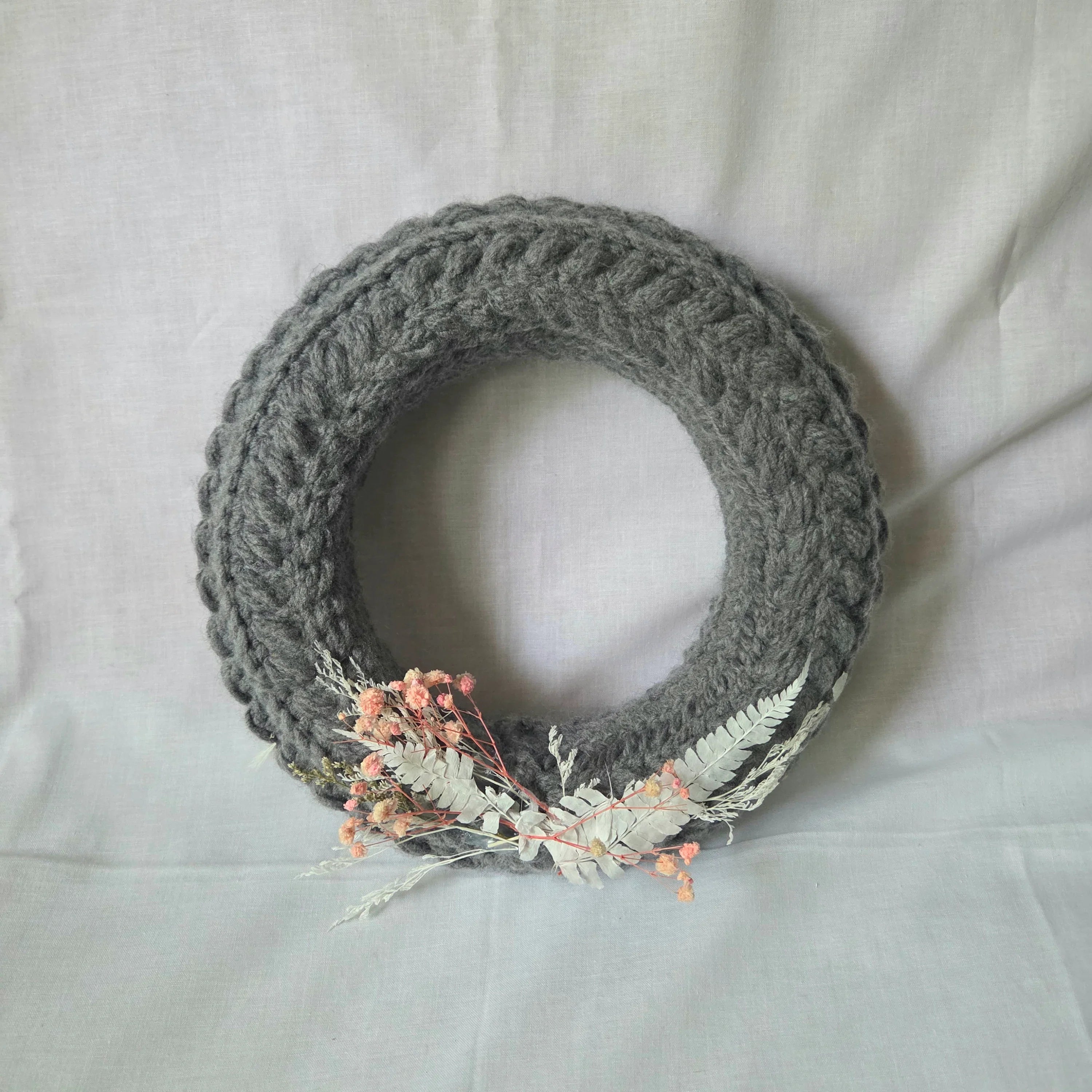 Gray crochet wreath with dried flowers and ferns, cozy handmade decor