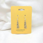 Handmade silver chain link dangle earrings on yellow card, minimalist jewelry gift