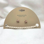 Handmade copper flower stud earrings with crochet accent on display card