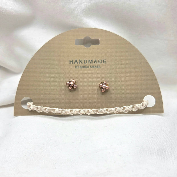 Handmade copper flower stud earrings with crochet accent on display card
