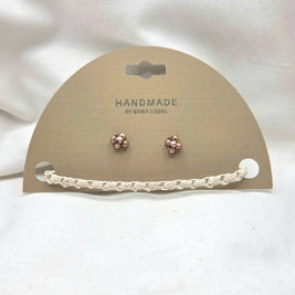 Handmade copper flower stud earrings with crochet chain on display card