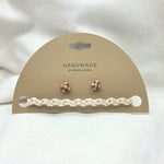 Handmade crochet bracelet and rose gold stud earrings on display card