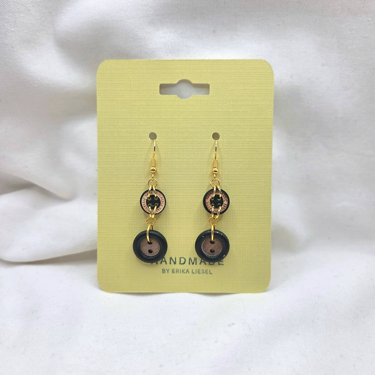 Handmade button earrings with gold hooks on yellow card, cozy crochet gift idea