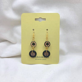 Handmade button earrings with gold hooks on yellow card, cozy crochet gift idea