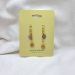 Handmade button earrings with gold chain, rustic charm on yellow card, cozy craft gift