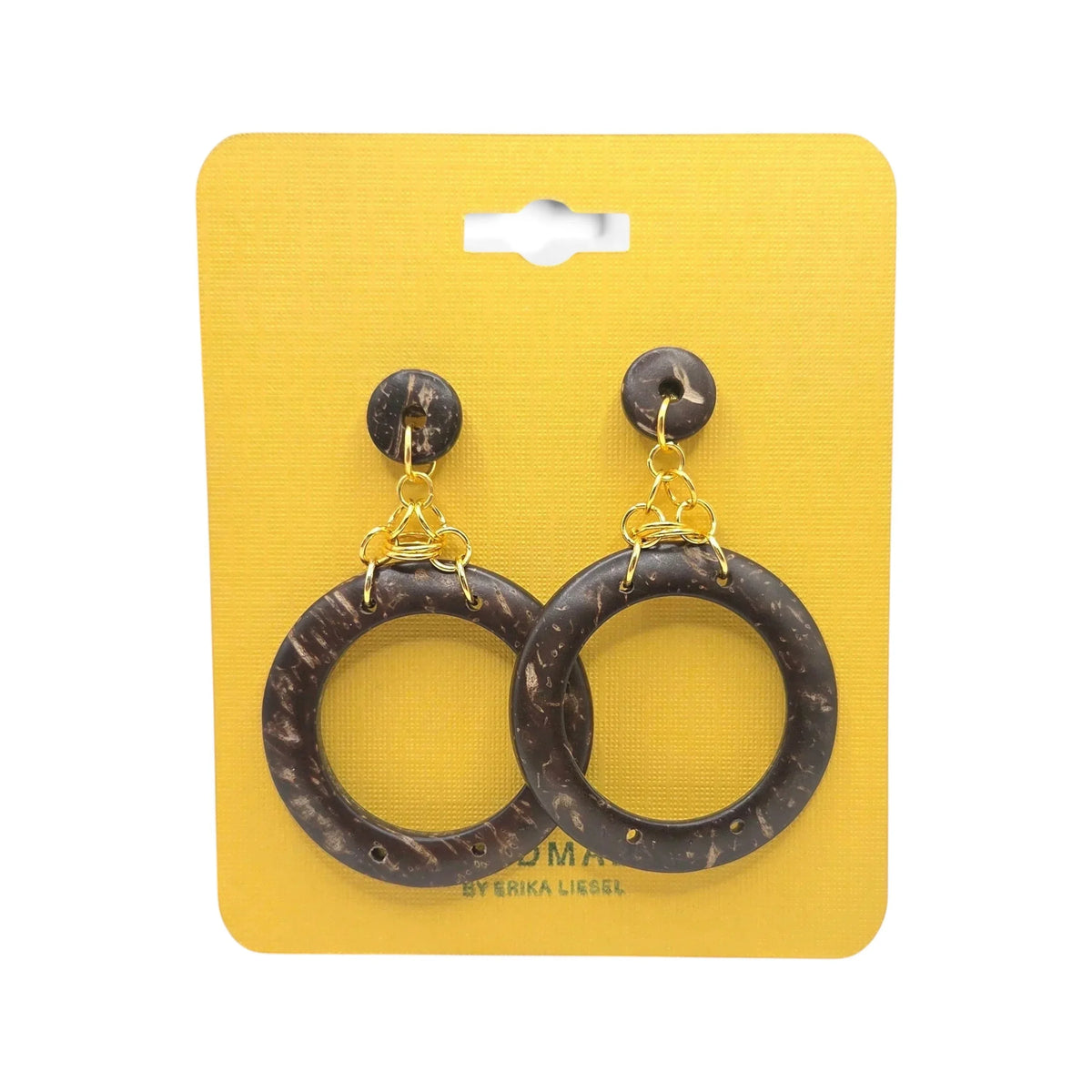 Handmade coconut shell hoop earrings with gold accents on yellow display card