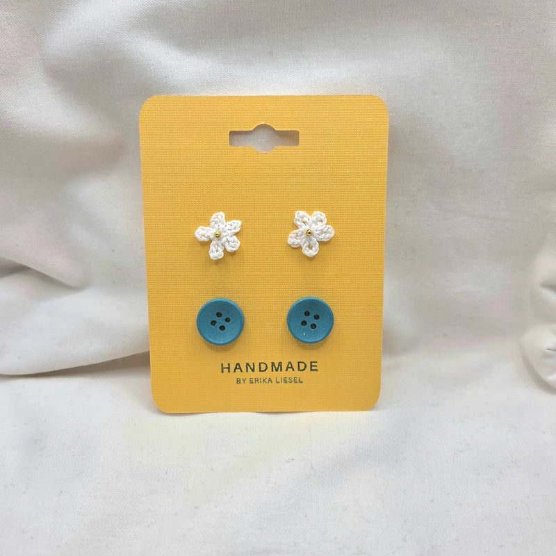 Handmade crochet flower and blue button earrings on yellow card, cozy craft gift set