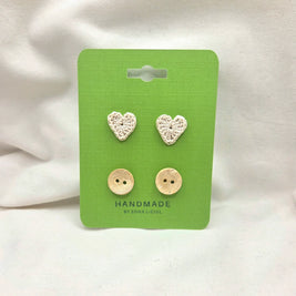 Handmade crochet heart and coconut buttons on green card, cozy craft supplies for DIY projects