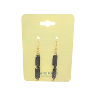 Handmade black stone dangle earrings with gold hooks on yellow card