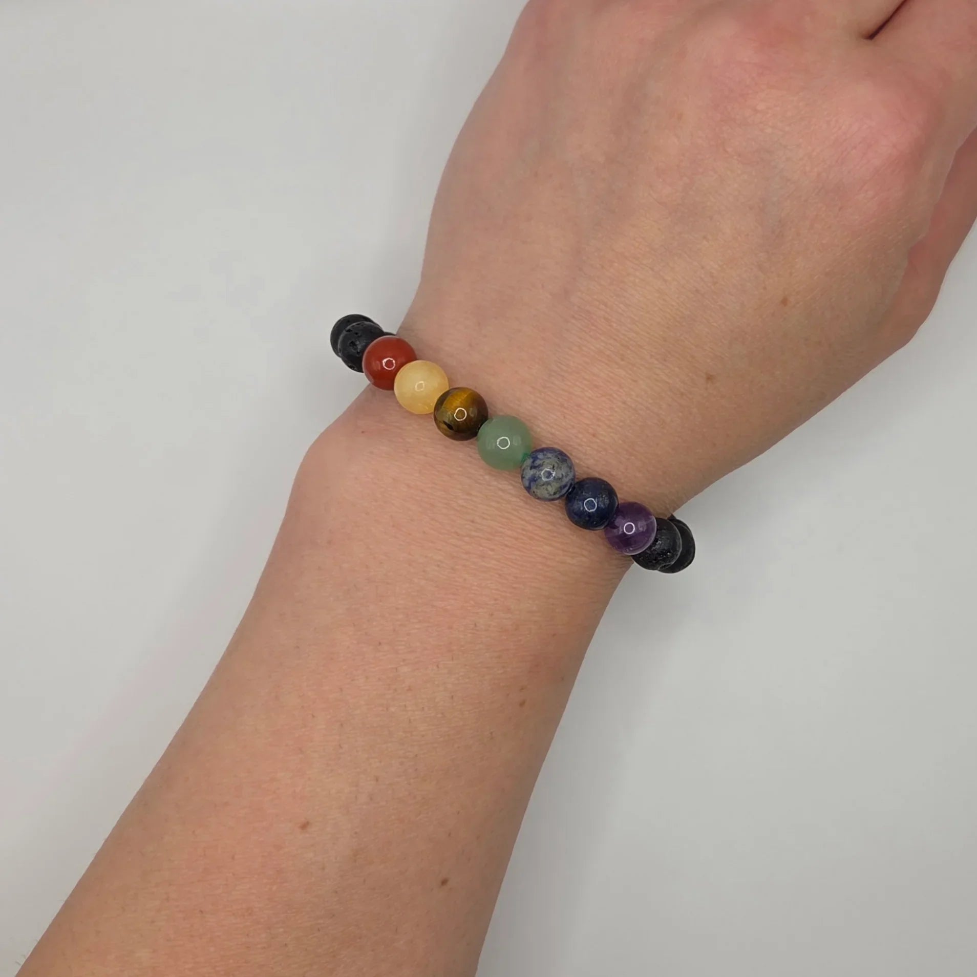 Colorful gemstone bracelet on wrist, handmade for comfort and creativity
