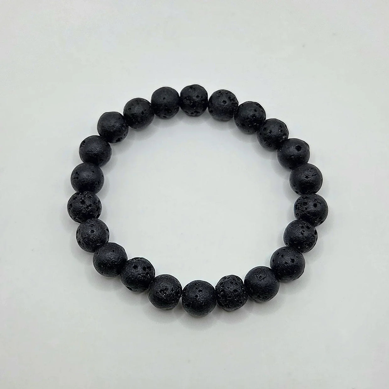 Black lava stone bracelet with porous texture, ideal for essential oils and aromatherapy wear