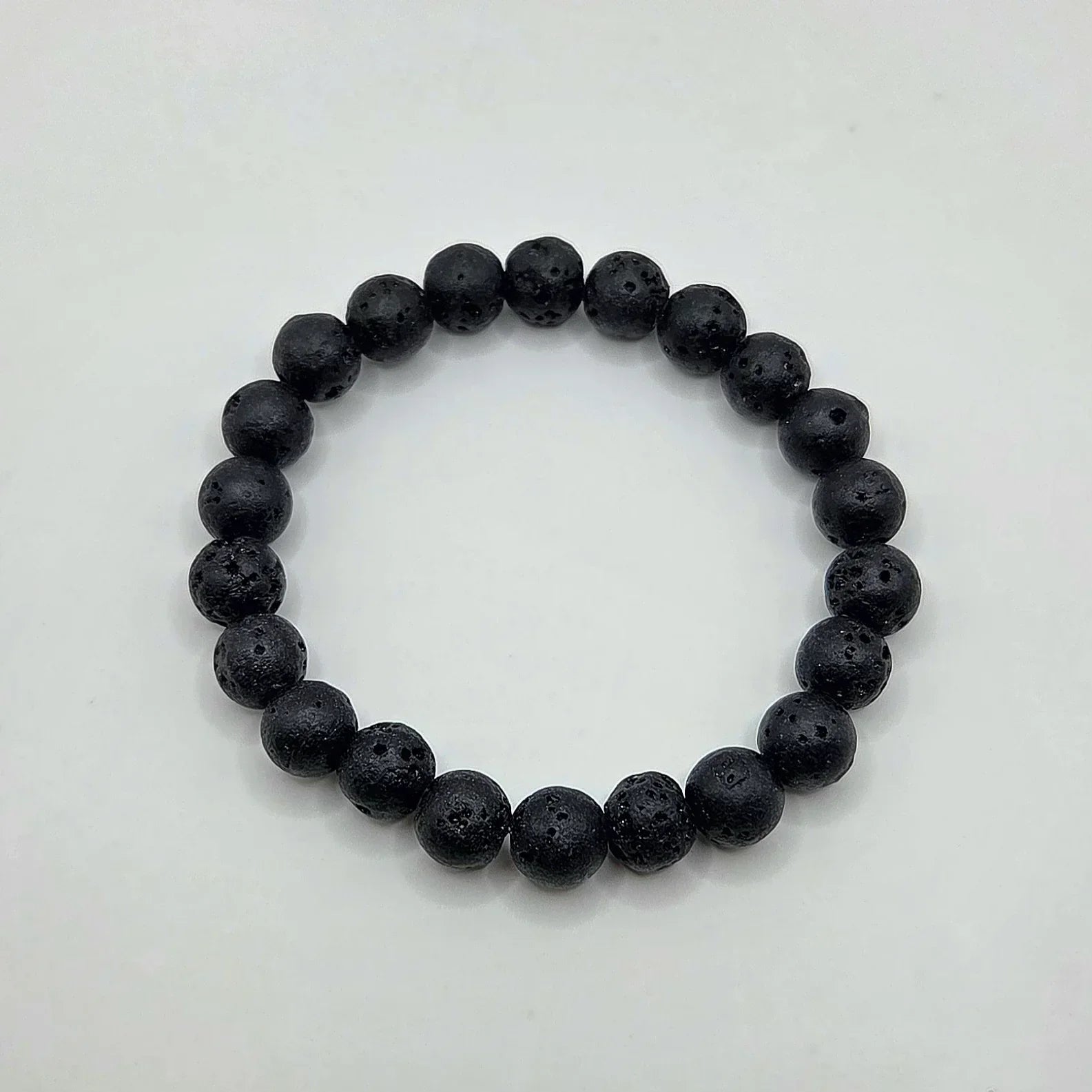 Black lava stone bracelet with porous texture, ideal for essential oils and aromatherapy wear