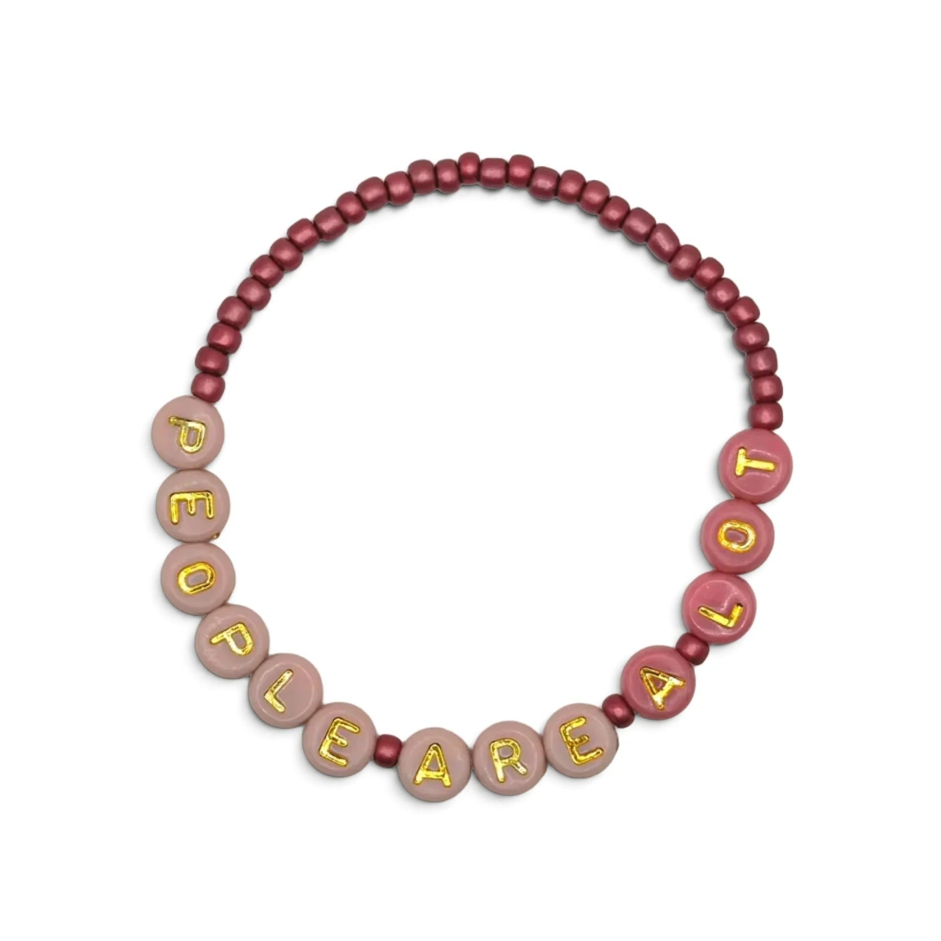 A beaded necklace or bracelet made of round beads, featuring a dark dusty rose beaded section and a lighter dusty pink section with gold lettering spelling out 'PEOPLE ARE A LOT'.