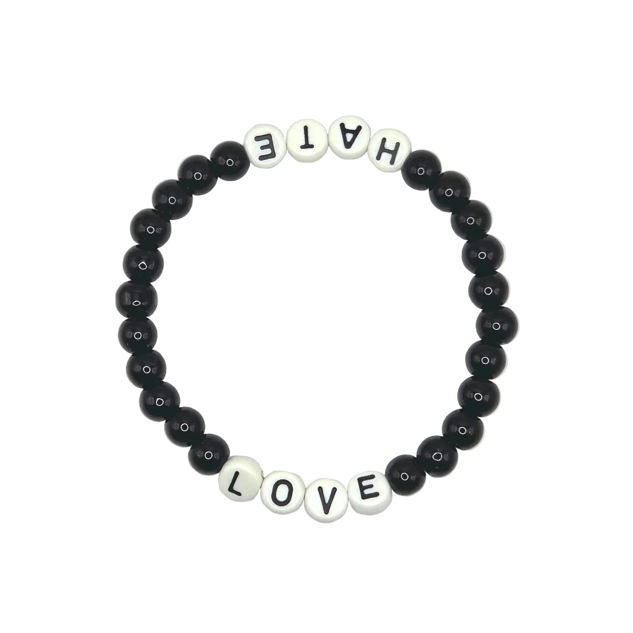 A beaded stretch bracelet on a plain white background, featuring black round beads and white letter beads spelling out 'HATE' on one side and 'LOVE' on the other.