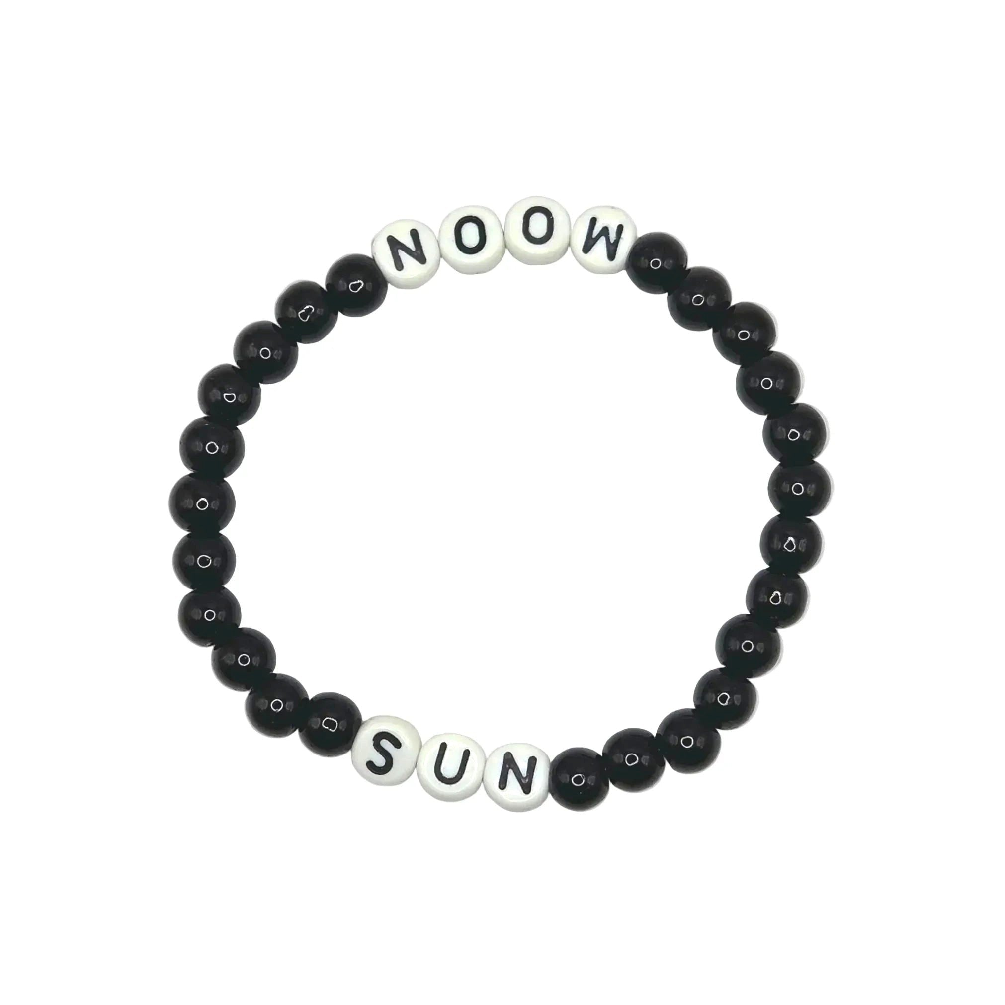 A beaded stretch bracelet on a light gray background, featuring black round beads and white square letter beads spelling 'NOOW SUN'.