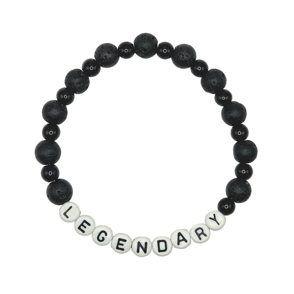 A beaded stretch bracelet featuring matte black lava stone beads and white letter beads spelling out 'LEGENDARY' on a plain white background.