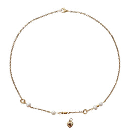 A delicate gold chain necklace with small white pearl beads and a small gold heart pendant, displayed on a clean white background.