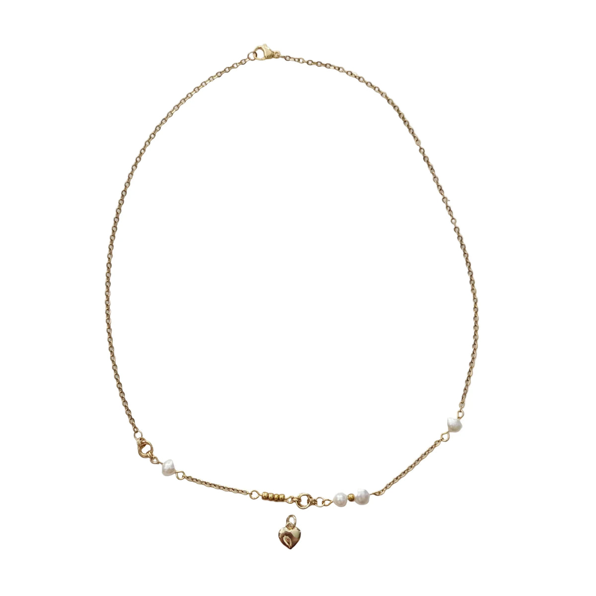 A delicate gold chain necklace with small white pearl beads and a small gold heart charm, displayed on a white background.