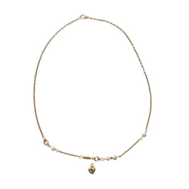 A delicate gold chain necklace with small white pearl beads and a small gold heart charm, displayed on a white background.