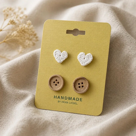 Handmade crochet heart and wooden button earrings on yellow card, cozy handmade gift