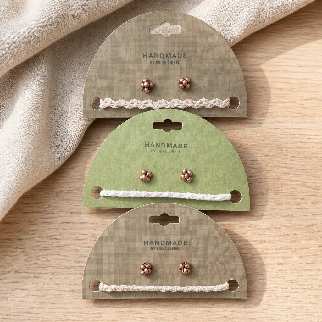 Handmade crochet hair ties with copper beads on eco packaging, cozy boho accessory set
